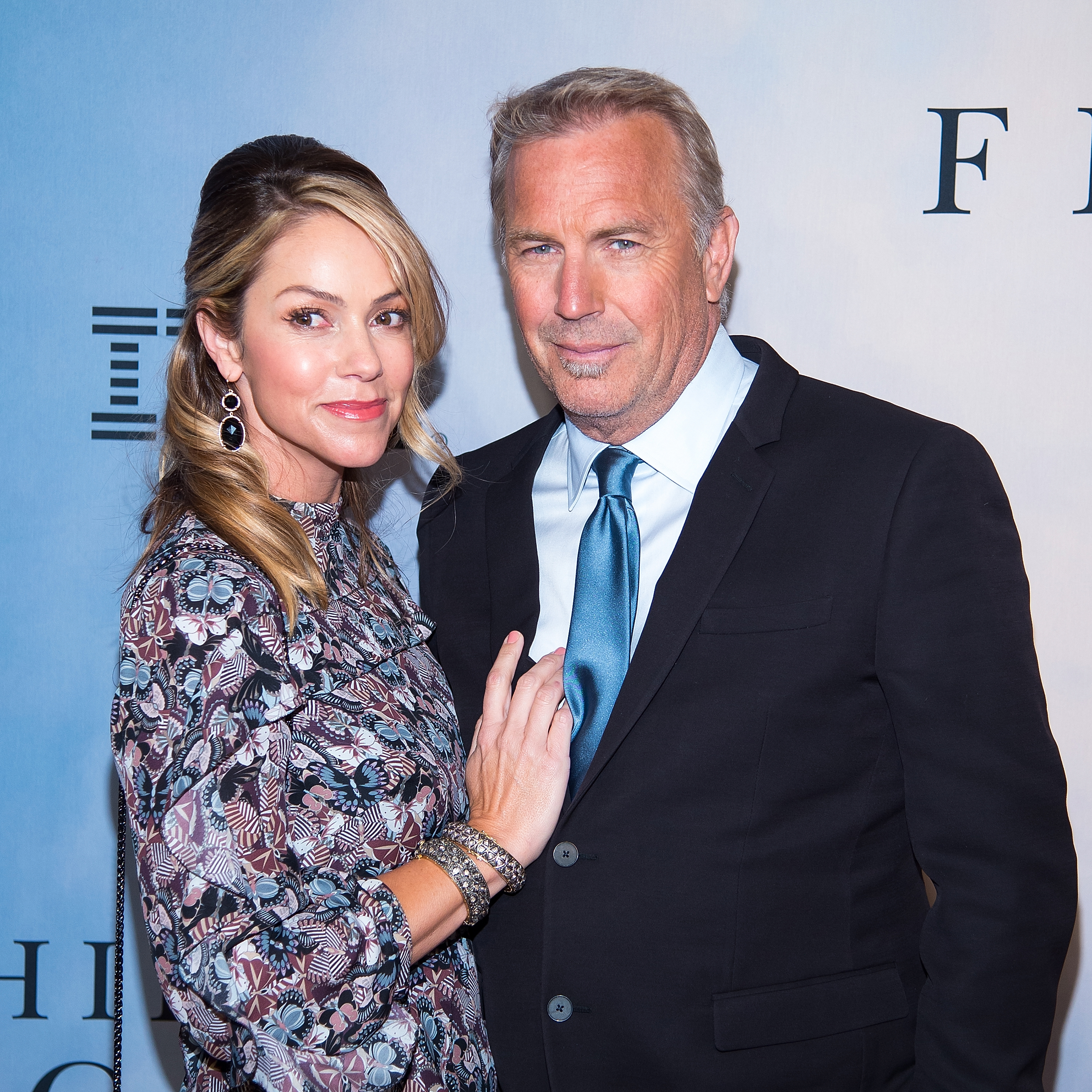 Christine Baumgartner and Kevin Costner at the special screening of "Hidden Figures" on December 10, 2016 in New York City | Source: Getty Images