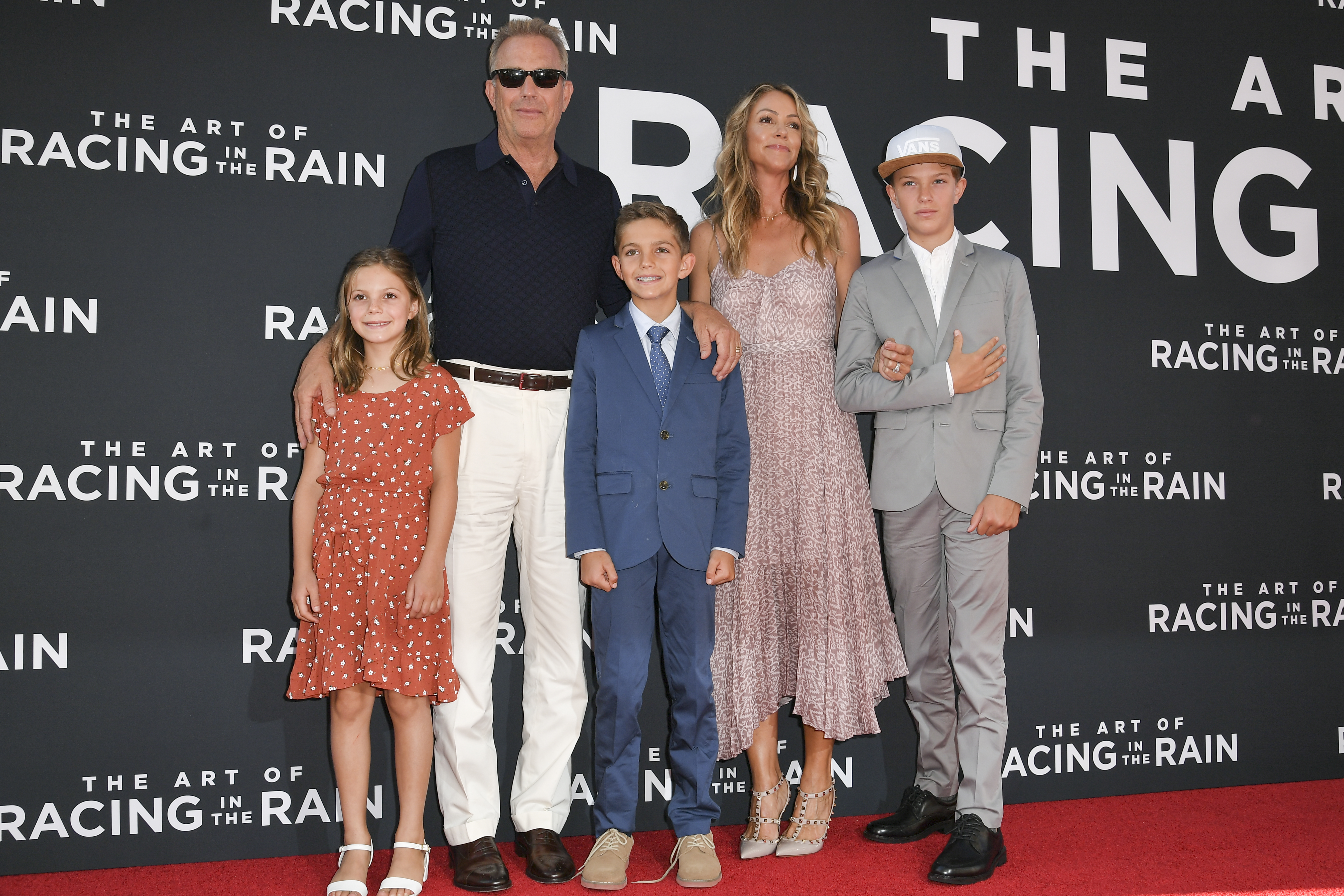 Kevin Costner and Christine Baumgartner at the 'The Art of Racing in the Rain' premiere at El Capitan Theatre, Los Angeles in 2019 | Source: Getty Images